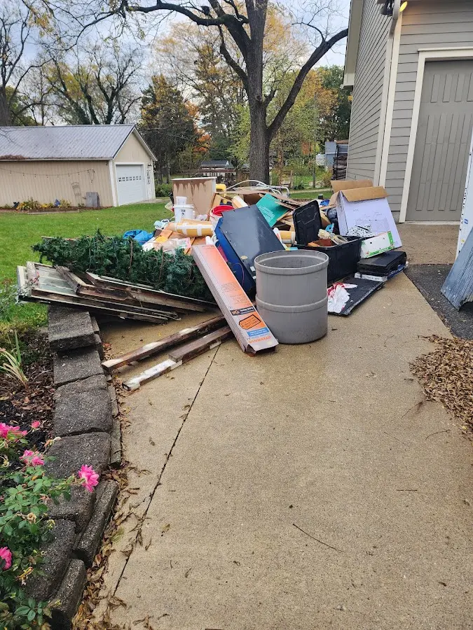 Dumpster being loaded with debris for Demolition Dumpster Rental in Keansburg